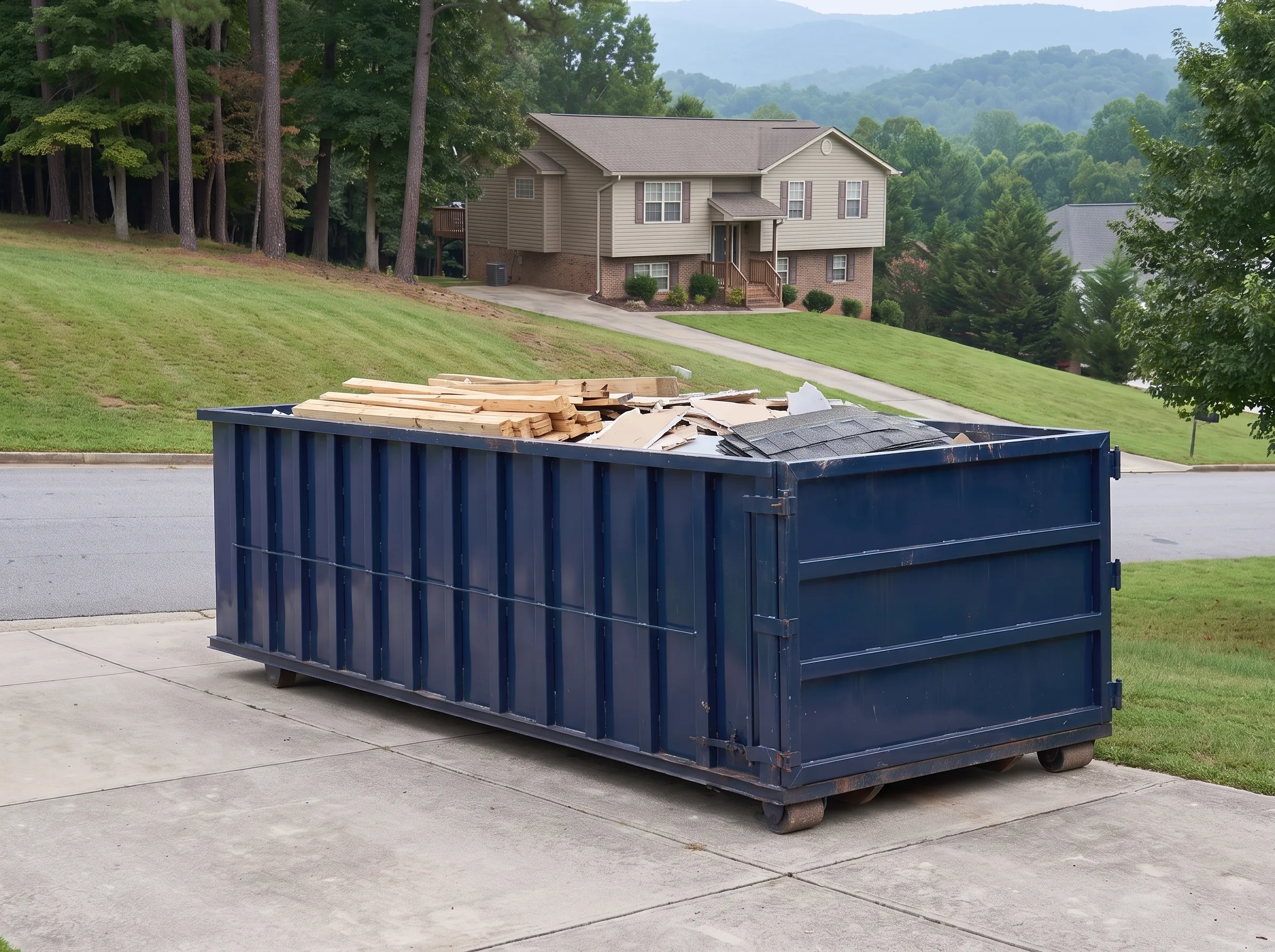 Roll-off dumpster being loaded in Cabarrus County, NC